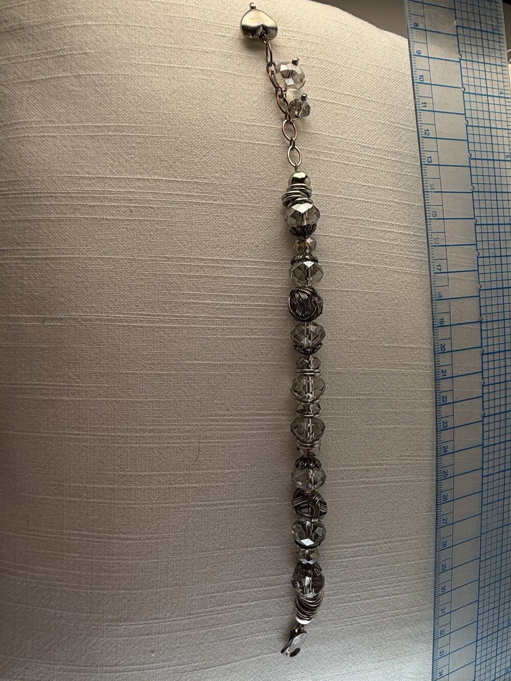 Silver tone beaded bracelet with faceted clear crystal beads and toggle clasp
